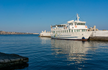 Fototapeta premium Fishing boats and Venetian Fortress in Heraklion harbor. Crete