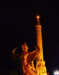 Garuda sculpture on big candle used in raining season