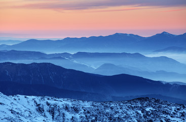 Fototapeta premium Sunset over color mountain silhouette.