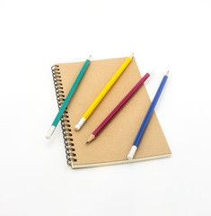 pencil and notebook on white background