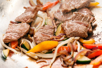 fried meat with pasta