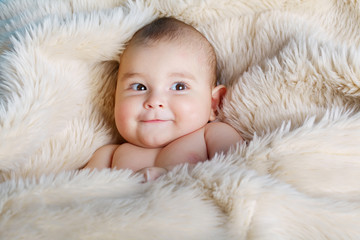 cute baby portrait lying on fur