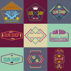 Pop art gun shop logotypes and badges vector set