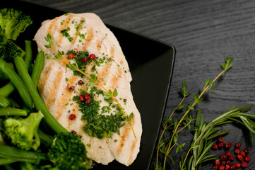 Delicious portion of chicken breast with steamed vegetables