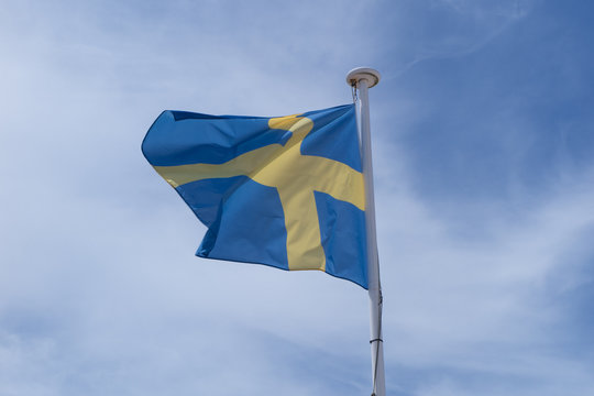 Flag swedish under blue sky