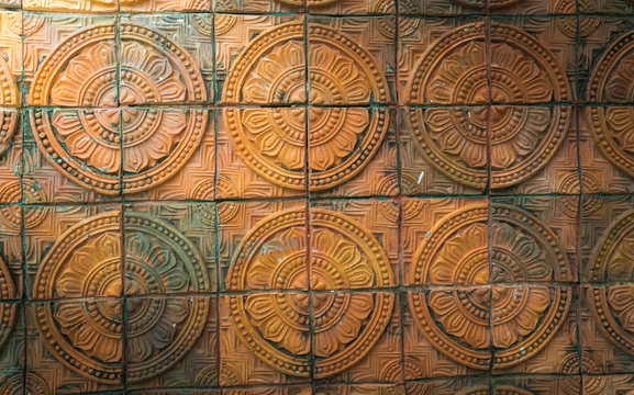 ancient thai art brick wall background with light from corner