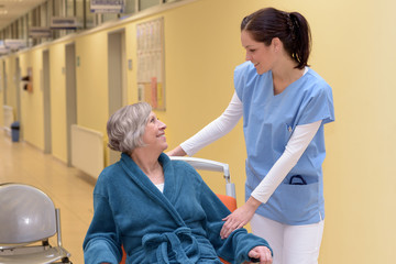 Nurse comforting senior patient