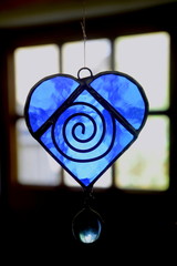 Blue painted heart made of glass