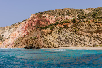 Colored rocks on Fyriplaka beach, Milos island, Cyclades, Greece.