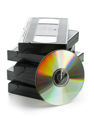 Stack of analog video cassettes with DVD disc