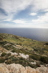 Dingli Cliffs coastline, Malta. A view across the rural fields of central Malta towards the Mediterranean sea on a bright and sunny spring day.