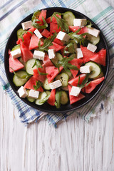 salad with feta, watermelon and arugula. vertical top view
