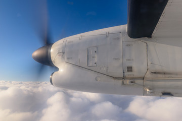 Naklejka na ściany i meble Aircraft Bombardier Dash-100 in the sky during the flight.
