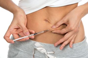 Doctor making diabetes patient insulin shot by syringe with dose