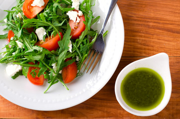 Green salad with arugula, tomatoes and feta cheese