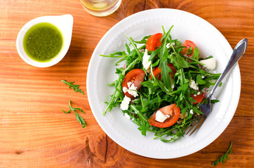 Green salad with arugula, tomatoes and feta cheese