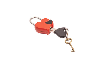 Red heart shaped padlock and keys isolated on white