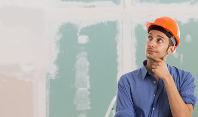 Worker in an apartment. Large copy-space © Minerva Studio