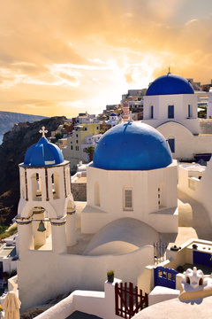 Fototapeta White church architecture in Oia Santorini village at dusk, in Greece