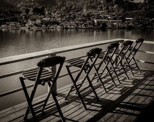 Fototapeta premium relax bamboo chairs on a beautiful lake