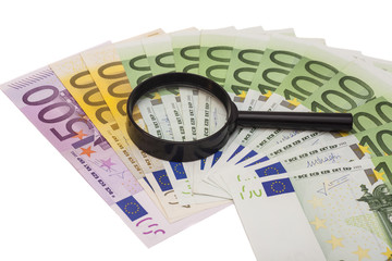 Euro banknote under magnifying glass