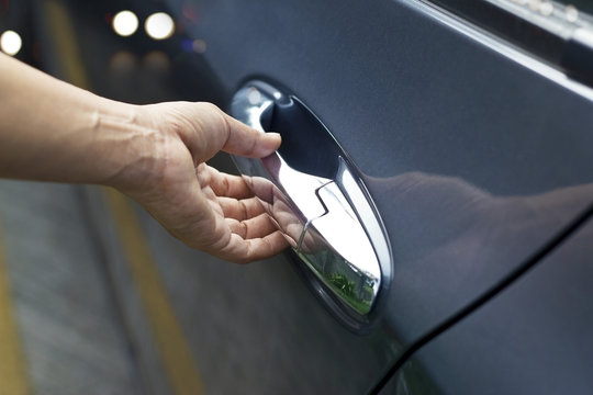 Hand On Handle, Man Opening A Car Door On The Street