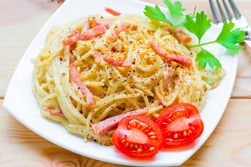 macaroni and cheese, and bacon in a creamy sauce