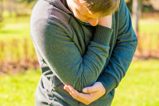 Young Man Grabbed Hand Sore Elbow