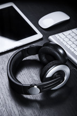 Business accessories over dark wooden table