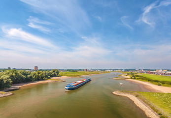 Obraz premium The Nederrijn river in front of the Dutch city of Arnhem
