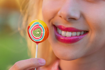 Beautiful woman with lollipop