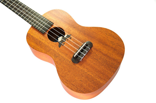 Close up of ukulele on white background