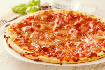 pizza on white wooden background
