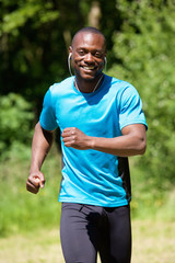 Happy smiling african american man running