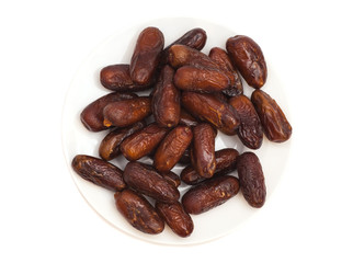 Fresh dates on white plate isolated on white background