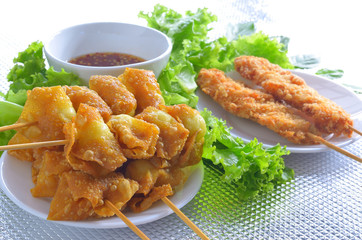 fried quail egg wrapped in wanton sheet and fried chicken