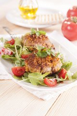 tasty chops with arugula and tomato 