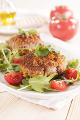 tasty chops with arugula and tomato 