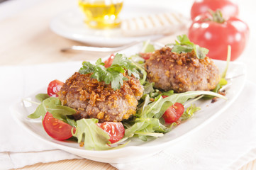 tasty chops with arugula and tomato 