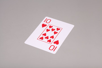 Ten of hearts playing card, isolated on gray background