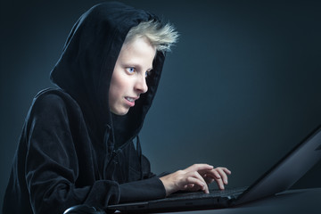 Teenager behind a computer