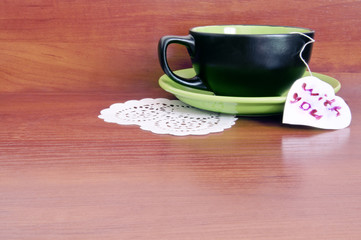 cup with a note on the table