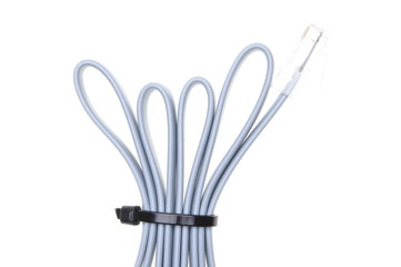 Patch cord with RJ45 plugs and cable ties isolated over white background