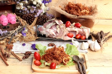 Dry roast pork into strips and raw pork.