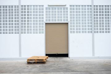 Roll garage gate and old wooden pallet