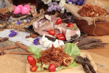 Dry roast pork into strips and raw pork.