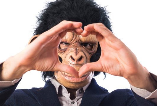 Monkey man making a heart with his hands
