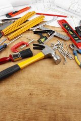 Assorted carpentry tools on wood