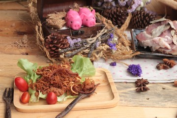 Dry roast pork into strips and raw pork.