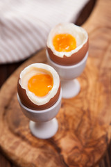 Boiled eggs on a wooden background